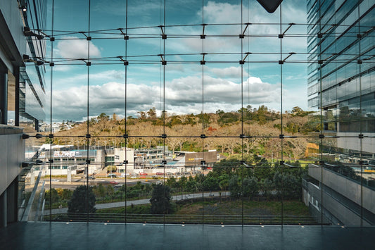 a view of a city through a glass window